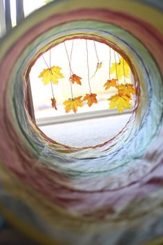 an instagramted photo with autumn leaves hanging from the ceiling