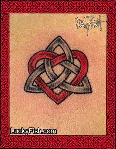 a celtic tattoo design on the back of a woman's upper arm, with an inter