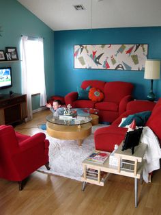 a living room filled with furniture and a baby sitting in the middle of the room