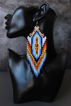 "These earrings are made of Czech beads. The lenth of the earrings is approx. 7.3\" with a hook The thread used is synthetic and very strong. Please ask if you have any questions. Shipping to the USA may take to 30 days (but usually it is about 10-15 days)" Aztec Earrings, Beadwork Ideas, Seed Bead Jewelry Patterns, Large Stud Earrings, Earrings Patterns, Bead Board, Native American Beaded Earrings, Beaded Earrings Patterns, Earrings Beaded