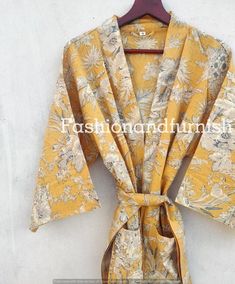 ITEM DESCRIPTION:These Cotton Floral Print Robes are luxurious and sweet, and will make you and your bridesmaids feel like you’re blossoming flowers !These robes are perfect for bridesmaids gifts, birthday gifts, and perfect gifts for girls who are in college.A beautiful lightweight cotton kimono-style hand-printed dressing gown. The gown is 100 cms length and 120 cms wide / bust approx. Features two front pockets, belt and loops.This soft cotton fabric is from India. Fabric has soft touch.Measu Kantha Pillow Covers, Embroidery Kimono, India Fabric, Winter Blankets, Yellow Outfit, Cotton Kimono, Womens Kimono, Bridesmaid Robes, Kimono Cardigan