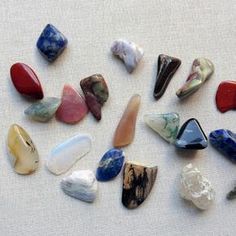 many different types of rocks on a white surface