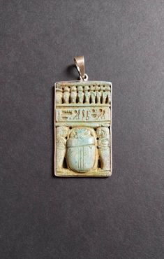 Here we have yet another, fabulous magickal amulet from Upper Egypt. This piece has been hand-carved by a master artisan, the material is limestone. An incredibly beautiful artifact to wear for all genders alike.  9 sacred uraei / cobras on top, a row of  hieroglyphic carvings and  a scarab = KhepRe flanked by 2 figures Size: 3 x 5 cm = 1.81 x 1.97 inch Please feel free to contact me for any questions. Carved Amulet Jewelry For Collectors, Collectible Etched Amulet Jewelry, Carved Bronze Amulet Jewelry, Bronze Carved Amulet Jewelry, Bronze Carved Amulet Style Jewelry, Bronze Carved Spiritual Jewelry, Bronze Carved Collectible Jewelry, Collectible Carved Bronze Jewelry, Ancient Handmade Ceremonial Jewelry