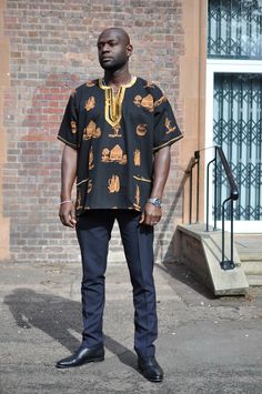 This men's  African Print Wakanda style 100% black polished cotton shirt with red embroidery is perfect for any special occasion such as traditional celebrations, events, weddings or proms, etc. The embroidery and excellent finishing helps to give a royal look Wash at 30 degrees. Wash similar colours, Hand wash for first wash. Also comes in sizes  S- 42 M - 44, L 46 , XL - 48, XXL 50 XXXL- 52  4XL - 54 . Delivery will be between 2 to 3 weeks for tailor-made products   A matching female one is also available to be made to match the shirt , please let me know the sizes and ill update you on prices Festive Black Embroidered Shirt, Festive Black Cotton Shirt, Traditional Black Embroidered Shirt, Fitted Black Embroidered T-shirt, Traditional Ceremonial Tops For Festivals, Traditional Black Summer Tops, Traditional Black Shirt For Summer, Traditional Black Cotton Shirt, Traditional Fit Short Sleeve Shirt