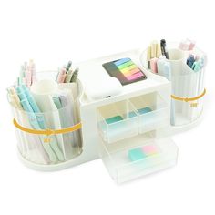 the desk is organized with pens, pencils and other office supplies in plastic containers