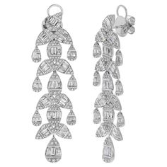 These stunning 18k White Gold Chandelier Earrings are designed to bring a touch of elegance and sophistication to any occasion. Featuring natural diamonds, these earrings shimmer with brilliance, making them the perfect statement piece for both formal events and special celebrations. Earring Information Diamond Type : Natural Diamond Metal : 18k Gold Metal Color : White Gold Total Carat Weight : 8 ttcw Diamond Color Clarity : E/F Color VS Clairty Lead Time : 4-8 Weeks (If out of Stock) JEWELRY C Pearl Chandelier Earrings, Diamond Chandelier Earrings, Diamond Chandelier, Pearl Chandelier, White Gold Diamond Earrings, Gold Chandelier Earrings, Antique Chandelier, Gold Chandelier, Gold Diamond Earrings