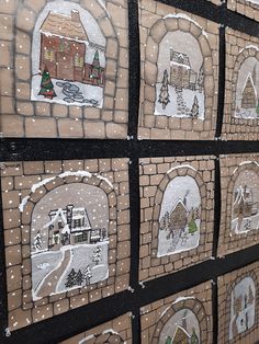 a wall covered in lots of different types of snow and houses on it's sides