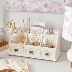 a white desk with many items on it