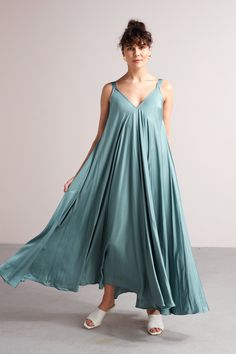 "MALIA dress. ✦ SURPRISING. MYSTICAL. FREE. ✦ Don't mind us, we're just fluttering by to let you know that this maxi dress would look so amazing on you! It features a lovely relaxed fit that looks amazing on any body type. It will be your number one for any special occasion. * Tailoring time - 3 weeks * ✅ SIZE & FIT Model is 173 cm/5'7 and wears ONE SIZE dress. Full length - 142 cm / 55,9\". Please note that all garment measurements might have slight variations due to the handmade nature of Light Blue Flowy Sleeveless Maxi Dress, Flowy Light Blue Sleeveless Maxi Dress, Light Blue Flowy Sleeveless Sundress, Blue Sleeveless Slip Dress For Beach, Blue Maxi Length Sleeveless Sundress, Blue Flowy Midi Sleeveless Dress, Blue Sleeveless Sundress Slip Dress, Blue Sleeveless Sundress Slip, Blue Flowy Sleeveless Midi Dress