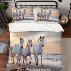 three white horses running in the snow on a bed with matching comforter and pillow cases