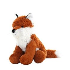 a small stuffed fox sitting on the ground