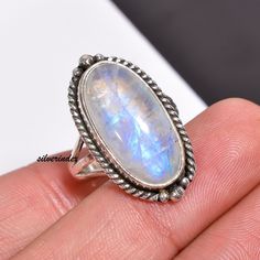 925 Sterling Silver Moonstone Bohemian Handmade Ring, Moonstone Jewelry, Oval Three Bnad Ring, Women Ring, Moon Ring, Rainbow Gift For Her            Moonstone is thought to provide protection to those who travel when the moon is shining . It may enhance intuition and promote inspiration. Moonstone also assists in the acceptance of love. ------------------------------------------------------------------------------------------------------------------------------------ All my Designs are original with 925 Sterling Silver  Size - All Size Ring Stone Name- Rainbow Moonstone Stone Shape- Oval Setting - Bezel Visit For more:-  https://www.etsy.com/in-en/shop/silverindex https://www.etsy.com/in-en/shop/silverindex?ref=seller-platform-mcnav My Spinner Section:- https://etsy.me/3kpiibx My Spinner Bohemian Oval Cabochon Moonstone Ring, Handmade Bohemian Oval Moonstone Ring, Bohemian Sterling Silver Oval Cabochon Moonstone Ring, Oval Moonstone Rings For Jewelry Making, Oval Moonstone Crystal Ring With Natural Stones, Bohemian White Oval Crystal Ring, Handmade Oval Cabochon Moonstone Ring, Oval Moonstone Crystal Ring Stamped 925, Bohemian Silver Moonstone Ring In Oval Cabochon