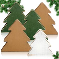 three wooden christmas trees on a white background