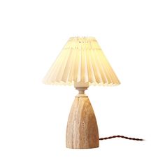 a table lamp with a white shade on it's base and a brown cord