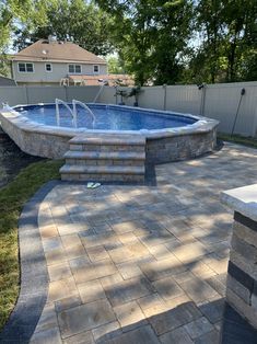 an above ground swimming pool with steps leading up to it