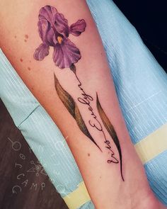 a woman's arm with a purple flower on it and the words, i love you