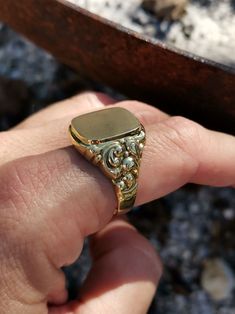 Wonderful vintage mid-century German men's signet ring, blank cartouche and ready to engrave with your initials, symbol, etc., massive 8k gold with two hallmarks (gold & maker's mark). The ring head has a decorative wreath on the side that emphasizes elegance, and a hefty 4.7 g weight. Material: 8k gold, hallmarked Total weight: 4.7 g US Size: approx. 11 (EU size 65) Box on the photos not included. PLEASE LOOK AT THE PICTURES, THEY ARE PART OF THE DESCRIPTION AND ARE THE ACTUAL ITEM YOU WILL REC Rectangular 14k Stamped Signet Ring Collectible, Collectible Yellow Gold Signet Ring With Engraving Option, Engraved 14k Gold Signet Ring Collectible, 14k Gold Engraved Signet Ring Collectible, Gold Oval Signet Ring With Maker's Mark, Heirloom Collectible 14k Stamped Signet Ring, Heirloom 14k Gold Signet Ring With Maker's Mark, Antique Yellow Gold Signet Ring With Engraving Option, Classic Collectible Signet Ring With Engraving