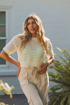 White Crochet Crop Top - Shop Kendry Collection Boutique Beige Hollow Out Summer Top, Beige Hollow Out Tops For Summer, Beige Hollow Out Top For Summer, Summer Knit Hollow Out Tops, Spring Summer Hollow Out Crochet Top, Summer Hollow Out Knit Tops, Chic White Crochet Top For Summer, Spring Crochet Lace Top For Day Out, Cream Crochet Top With Trim For Vacation