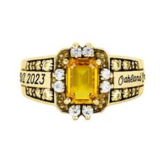 A highly detailed distinctively feminine design that looks fantastic whether you're wearing a graduation gown or an evening gown. Celebrate everything you've accomplished at Oakland University with the Illusion ring and treasure the memories of these years forever. A lovely emerald-cut stone sits at the top of this ring accented with twenty cubic zirconias or diamonds on the top and sides. The central sections on the sides can contain your school name and up to 15 characters for your degree lett Heirloom Emerald Cut Birthstone Promise Ring, Heirloom Emerald Cut Birthstone Diamond Ring, Heirloom Emerald Cut Diamond Ring With Birthstone, Radiant Cut Birthstone Ring With Accent Stones For Anniversary, Rectangular Birthstone Ring With Prong Setting For Anniversary, Anniversary Birthstone Ring With Radiant Cut And Accent Stones, Gold Emerald-cut Birthstone Ring For Anniversary, Gold Emerald Cut Birthstone Ring For Anniversary, Gold Emerald Cut Birthstone Ring For Promise