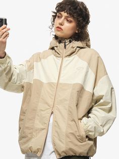 Jacket designed by CPGN. Unique and comfortable item that is good to have as a light outer. Recommend having this as a casual wear or even suitable for light activities.  - Oversized fitting silhouette- Hoodie with adjustable string and stopper- 2-way zip-up closure- Banded cuff detail- Adjustable hem with string and stopper Oversized Beige Windbreaker With Long Sleeves, Oversized Beige Long Sleeve Windbreaker, Casual Beige Long Sleeve Windbreaker, Beige Long Sleeve Casual Windbreaker, Oversized Khaki Windbreaker Casual Style, Oversized Beige Casual Windbreaker, Casual Khaki Nylon Outerwear, Casual Beige Windbreaker, Beige Nylon Outerwear For Outdoor Activities