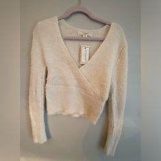 This Beautiful, Soft Cream Colored V-Neck Cropped Sweater Will Be A Staple For Your Fall And Winter Wardrobe Size Xl Nwt Smoke Free Cream V-neck Top For Fall, Cream Soft Knit V-neck Sweater, Chic White V-neck Sweater, White Soft Knit V-neck Sweater, Cream V-neck Top For Winter, Cream V-neck Winter Top, White V-neck Soft Knit Sweater, White V-neck Sweater For Spring, White V-neck Top For Fall