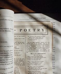 an open book sitting on top of a wooden table