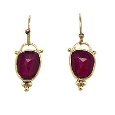 A vibrant pair of rosecut rubies are set in 14k yellow gold with gold accent beads Finished with hand formed solid gold ear wires. Approximate stone size: 10mm x 9mm Approximate stone weight: 5.9cts Mohs Hardness scale: 9 This piece is handmade to order in Emily's Hudson Valley studio. Please allow for slight variations in stone color, size and shape. Please allow 14-21 days to ship unless the piece is in stock. If you have questions about sizing, shipping or custom orders please reach out to us Ruby Gemstone Drop Earrings, Ruby Teardrop Earrings Fine Jewelry, Red Ruby Gemstone Earrings, Exquisite Ruby Gold Earrings, Gold Faceted Ruby Earrings, Local Jewelry, Gold Accents, Stone Color, Ruby