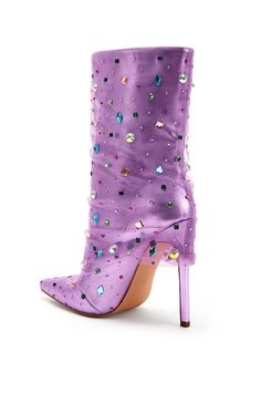 **FINAL SALE - NO EXCHANGES OR RETURNS** All the glam and luxury you would ever want out of a heeled boot! The Liora Stiletto Boot in Lilac Purple features a metallic, shiny base with a pointed toe silhouette. There is a tulle overlay on the boot and multicolored chunky rhinestones scattered all over the shoe. These are perfect for adding a pop of color to any elevated outfit! Trendy High-top Mid-calf Party Boots, Trendy High-top Mid-calf Boots For Party, Trendy Heeled Boots For Party With Reinforced Heel, Trendy Heeled Boots With Reinforced Heel For Party, Glamorous Knee-high Spring Boots, Glamorous High Ankle Boots For Party, High-top Party Boots For Spring, Chic Rhinestone Boots For Party Season, Spring Party High-top Boots