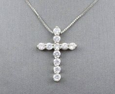 beautiful diamond cross pendant sku-4052cr setting information metal----------------10 karat white gold setting-----------------double share prong finish------------------high polish width------------------15.4 mm height-----------------21 mm simulated diamond information quantity----------------11 shape--------------round total weight------------1 carat Custom Orders: Please feel free to contact us if you could not find the piece you had in mind. We know how important it is to find the right je White Cubic Zirconia Crucifix Jewelry, Silver Diamond Round Cross Necklace, Silver Diamond Cross Pendant Necklace, White Cubic Zirconia Cross Necklace With Diamond Cut, White Diamond-cut Pendant Cross Necklace, White Diamond Cross Necklace Fine Jewelry, White Diamond Cut Pendant Cross Necklace, Fine Jewelry White Diamond Cross Necklace, White Cross Diamond Necklace Fine Jewelry