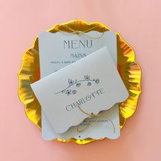 a plate that has some type of menu on it, with the name charlotte written on it