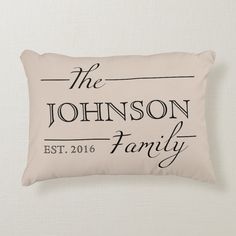 a personalized pillow with the names of two people on it, in black and white