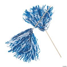 two blue pom - poms with wooden sticks attached to them on a white background