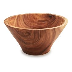 a wooden bowl sitting on top of a white surface