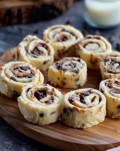 chocolate chip cinnamon rolls on a wooden plate