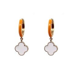 Score a style touchdown with these Clover Dangle Earrings! Featuring a 1 1/2 inch orange enamel huggie earring with a white clover dangle, these earrings are perfect for adding a touch of fun and energy to your gameday outfit. Show off your Volunteer pride in these stylish and classic earrings. 1 1/2in ORANGE ENAMEL HUGGIE EARRING WITH WHITE CLOVER DANGLE Trendy White Enamel Earrings, Trendy Hypoallergenic Enamel Earrings, Trendy Enamel Drop Earrings, Trendy White Enamel Jewelry, Trendy Small Hoop Orange Jewelry, White Enamel Small Hoop Earrings, White Enamel Drop Earrings, Trendy White Small Hoop Earrings, White Enamel Hoop Earrings