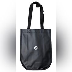 Lululemon Reusable Shopping Bag! Black And White. New In Package! * Lululemon Reusable Shopping Bag * It Measures 12 Inches From Top To Bottom And 9-1/2 Inches Across * Comes With Button On Top For Closure Of The Bag * Never Used. Still In Original Package! Please See All Photos As They Are Part Of The Description. From A Smoke And Pet Free Home Casual Black Reusable Bag, Black Casual Reusable Bag, Lululemon Shopping Bag, Lululemon Rectangular Bag With Zipper Closure, Functional Black Reusable Bags, Black Lululemon Bag For On-the-go, Lululemon Shoulder Bag With Removable Pouch For On-the-go, Versatile Lululemon Bags For On-the-go, Black Reusable Nylon Bag