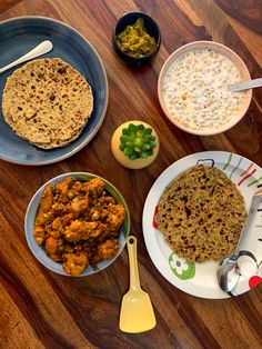 the meal is prepared and ready to be eaten on the wooden table with utensils