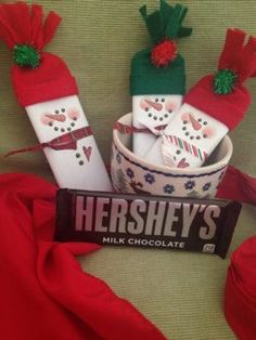 hershey's milk chocolate is wrapped in red ribbon and decorated with snowmen