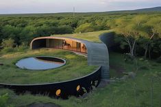 an unusual house in the middle of a field