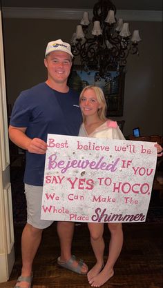 a man and woman standing next to each other holding a sign that says best believe well be beneficial if you say yes to hoo we can make the whole