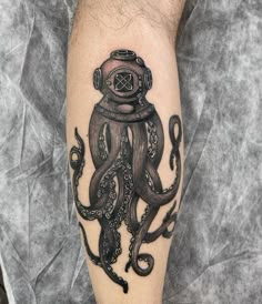 an octopus with a diving mask on its head is depicted in this tattoo art piece