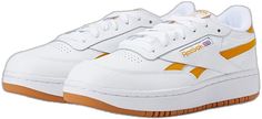 Reebok Lifestyle Club C 85 - Women's Shoes : White/Bright Ochre/Gum : Bring classic tennis style to your wardrobe with the Reebok Lifestyle Club C 85 sneakers. Casual shoes in a classic silhouette with durable leather uppers. Lace-up adjustability. Soft fabric linings. Padded collar. Cushioned foam insole. Shock-absorbing EVA midsole. Rubber outsole stands up to abrasive surfaces. Imported. Measurements: Weight: 11 oz Product measurements were taken using size 9, width B - Medium. Please note th Retro White Sneakers With Contrasting Heel Counter, Retro Sneakers With Contrasting Heel Counter, Retro Leather Skate Shoes For Spring, Retro Leather Skate Shoes, Retro Skate Shoes With Cushioned Footbed, Retro Skate Shoes With Cushioned Footbed And Round Toe, Retro Synthetic Sneakers With Round Toe, Retro Leather Skate Shoes With Rubber Sole, Retro Synthetic Skate Shoes With Cushioned Footbed