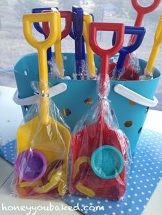 plastic toys are sitting in bags on a table