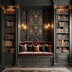 a room with bookshelves filled with lots of books and pillows on the couch