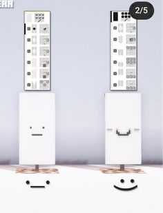 two white cabinets with faces on each side and the same one behind them, in front of a gray wall