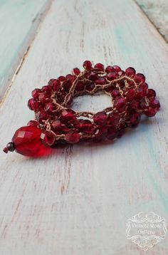 Red Crochet Bracelet , Ruby Red Crochet  Necklace, 6 Wrap Crocheted Bracelet , Boho Chic Statement  Necklace One  of my favourite pieces : Pomegranate Necklace / Bracelet  An amazing Boho Chic ruby red  Crocheted Necklace ! So beautiful , so sparkling  and so airy .... Features ruby red Czech crystal beads 6mm , nylon cord and  a large , ruby red  Czech crystal bead  for closure  When I first saw these beads I remembered of pomegranate , I think you can see it at the result of this unique neckla Adjustable Crochet Jewelry Bracelet, Unique Handmade Red Bracelet, Bohemian Crochet Bracelet, Bohemian Crochet Bracelets As Gift, Adjustable Crochet Bracelet, Handmade Adjustable Lariat Bracelets, Bohemian Burgundy Jewelry As Gift, Bohemian Burgundy Jewelry Gift, Handmade Burgundy Bracelets As Gift