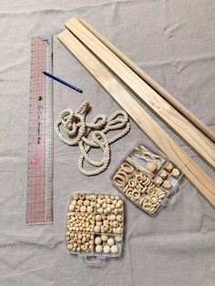 the supplies needed to make this craft include beads, wooden dows, and rope