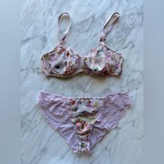 Victoria’s Secret Nwot Floral Cut Out Unlined Wicked Balconet Push-Up Without Padding. It’s A Soft Lilac Color. The Bra Is A 32d. Panties Are A Medium, They Have Cute Little Ruching On The Back. I Only Wore The Set A Handful Of Times And I Think I Washed Them A Couple Of Times As Well. Both Are In Great Condition. Fitted Lavender Bra For Spring, Fitted Lavender Bra With Padded Cups, Feminine Fitted Lavender Bra, Feminine Fitted Victoria's Secret Bra, Fitted Feminine Victoria's Secret Bra, Feminine Fitted Purple Bra, Lavender Feminine Bra, Fitted Feminine Purple Bra, Lavender Fitted Push-up Bra