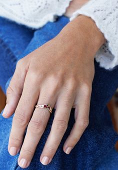 The graceful "V" of the 14k solid gold Isabelle Ring will elongate and accentuate your finger. It also makes it ideal to stack with other rings. The center marquise diamonds or rubies are 4x2mm and .20ct. Round diamonds or rubies are 1.25-2mm. Diamond quality is G-H color and VS2-SI1 and ruby quality is AAA. Band width is 2mm wide and 1.5mm thick. *Contact us for custom stone and sizing - price may vary - info@talonnyc.com Marquise Diamond, Round Diamonds, Solid Gold, Ruby, Diamonds, Yellow Gold, Band, Ring, Stone