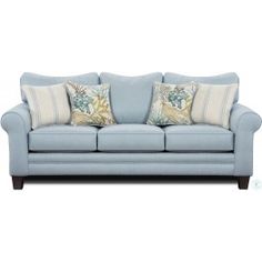 a blue couch with two pillows on it